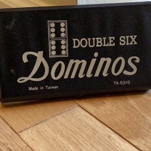 Vintage Double Six Dominos in snap closure carrying case.  Pristine condition.